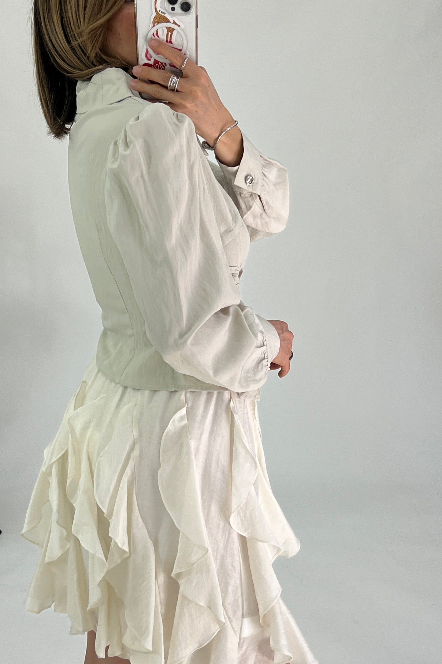 BLUSA BAJO EN PICOS