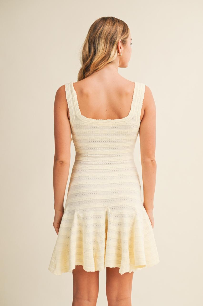 VESTIDO BAJO CON VUELO