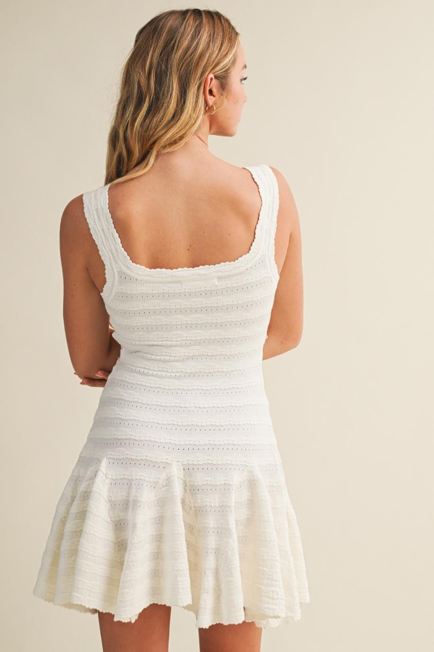 VESTIDO BAJO CON VUELO