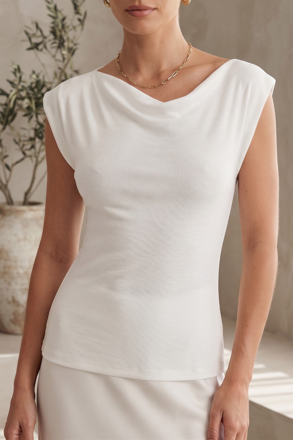BLUSA HOMBROS IRREGULARES