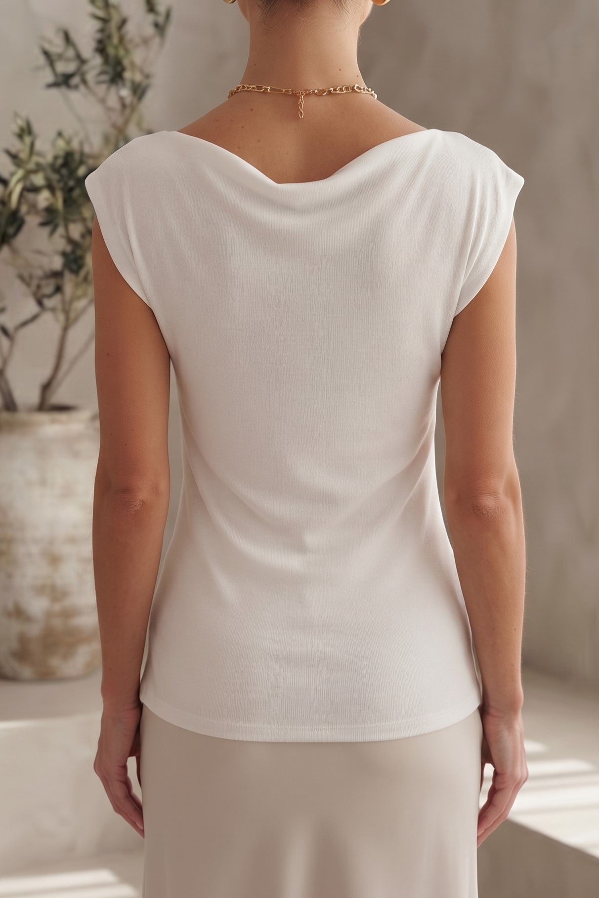 BLUSA HOMBROS IRREGULARES